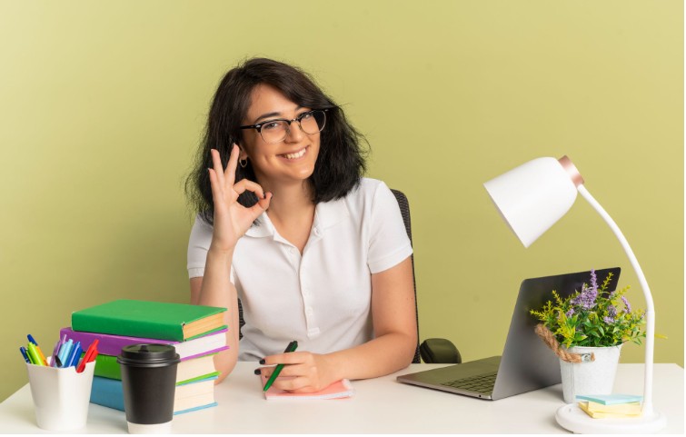 Student preparing for IELTS at home with organized study desk and learning setup